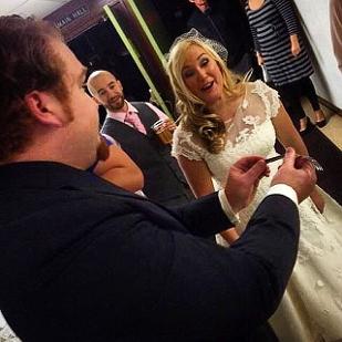 Magician Daniel Jaspersen entertaining the bride at her wedding in Milwaukee Wisconsin